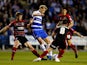 Pavel Pogrebnyak of Reading is tackled by Paul Dixon and Jacob Butterfield of Huddersfield during the Sky Bet Championship match between Reading and Huddersfield Town at Madejski Stadium on August 19, 2014