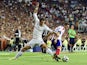 Real Madrid's Welsh forward Gareth Bale vies with Atletico Madrid's midfielder Koke during the Spanish Supercup first-leg football match Real Madrid CF vs Club Atletico de Madrid at the Santiago Bernabeu stadium in Madrid on August 19, 2014