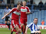 Steve Howard of Sheffield Wednesday contests the ball with Richard Smallwood of Middlesbrough during the npower Championship match between Sheffield Wednesday and Middlesbrough at Hillsborough Stadium on May 4, 2013