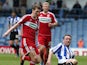 Steve Howard of Sheffield Wednesday contests the ball with Richard Smallwood of Middlesbrough during the npower Championship match between Sheffield Wednesday and Middlesbrough at Hillsborough Stadium on May 4, 2013