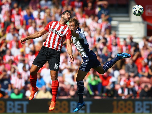Graziano Pelle of Southampton and Craig Dawson of West Brom compete for the ball during the Barclays Premier League match between Southampton and West Bromwich Albion at St Mary's Stadium on August 23, 2014