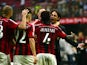 AC Milan's midfielder of Ghana Sulley Ali Muntari celebrates with AC Milan's coach Filippo Inzaghi after scoring during the Serie A football match AC Milan against Lazio on August 31, 2014