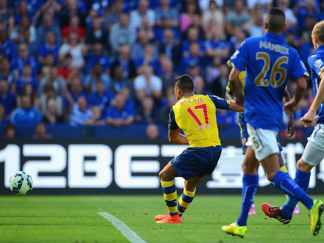 Alexis Sanchez of Arsenal scores his team's opening goal during the Barclays Premier League match against Leicester City on August 31, 2014