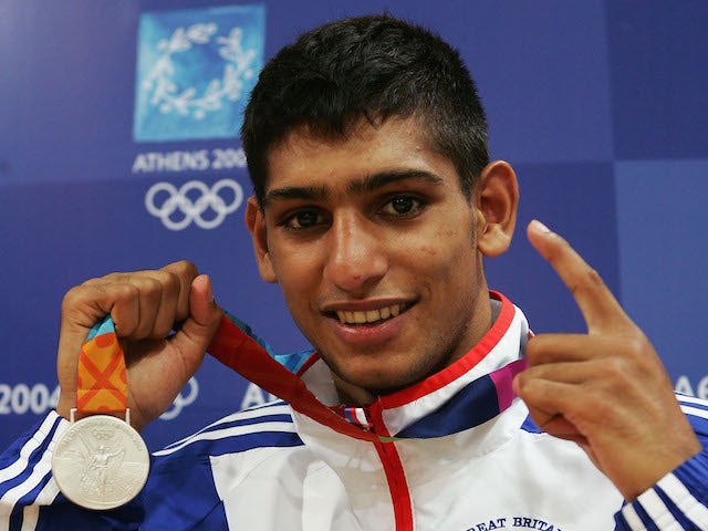 Amir Khan of Great Britain poses with his bronze medal for the men's boxing 60 kg event on August 29, 2004