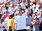Andy Murray of Great Britain signs waves to fans after defeating Robin Haase of the Netherlands during his men's singles first round match on Day One of the 2014 US Open at the USTA Billie Jean King National Tennis Center on August 25, 2014