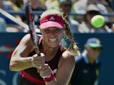 Angelique Kerber of Germany returns a shot to Ksenia Pervak of Russia during their 2014 US Open women's singles match at the USTA Billie Jean King National Tennis Center August 25, 2014