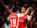 Alexis Sanchez of Arsenal celebrates with team mate Santi Cazorla of Arsenal after scoring during the UEFA Champions League Qualifier 2nd leg match between Arsenal and Besiktas at the Emirates Stadium on August 27, 2014
