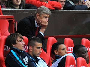 Wenger sorry for Manchester United defeat