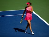 Belinda Bencic of Switzerland reacts against Angelique Kerber of Germany during their women's singles third round match on Day Five of the 2014 US Open at the USTA Billie Jean King National Tennis Center on August 29, 2014