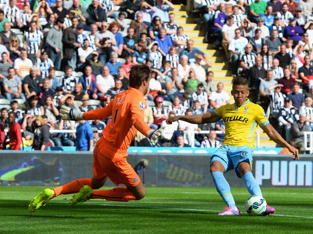 Dwight Gayle of Crystal Palace scores the opening goal past Tim Krul of Newcastle United during the Barclays Premier League match between Newcastle United and Crystal Palace at St James' Park on August 30, 2014