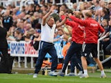 Manager Neil Warnock of Crystal Palace turns to celebrate with his coaching staff after Wilfried Zaha of Crystal Palace scored their third goal and equaliser in stoppage time during the Barclays Premier League match between Newcastle United and Crystal Pa