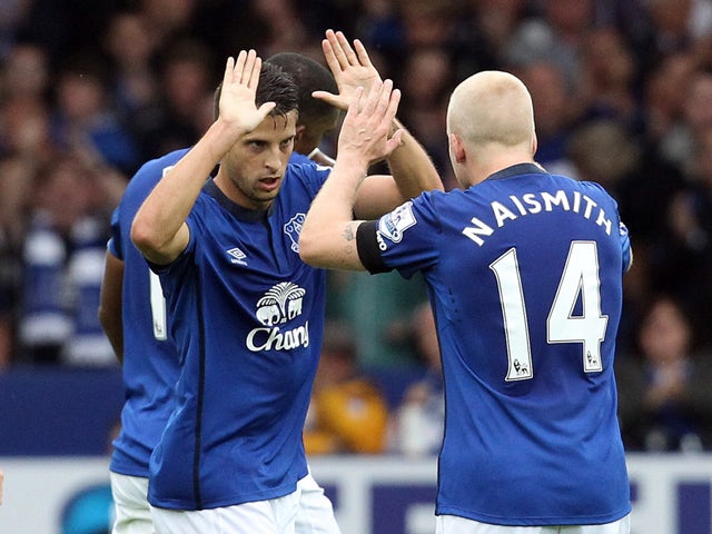 Everton's Belgian striker Kevin Mirallas celebrates his goal during the English Premier League football match between Everton and Chelsea at Goodison Park in Liverpool, northwest England on August 30, 2014