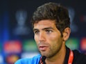 Federico Fazio of Sevilla FC talks to the media during the Sevilla FC press conference at Cardiff City Stadium on August 11, 2014