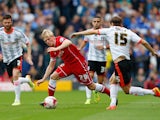 Mats Daehli of Cardiff City is challenged by Kay Voser of Fulham during the Sky Bet Championship match between Fulham and Cardiff City at Craven Cottage on August 30, 2014