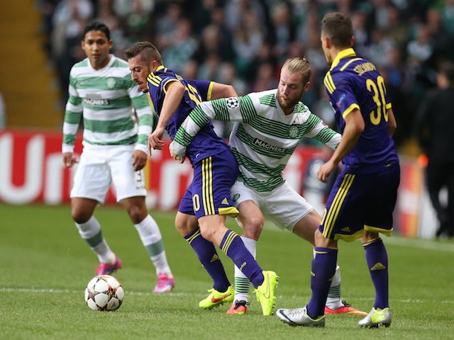 Agim Ibraimi of NK Maribor vies with Jo Inge Berget of Celtic during the UEFA Champions League Qualifying Play-Offs Round, Second Leg Match on August 26, 2014