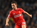 Joe Allen of Liverpool in action during the Barclays Premier League match between Manchester City and Liverpool at the Etihad Stadium on August 25, 2014