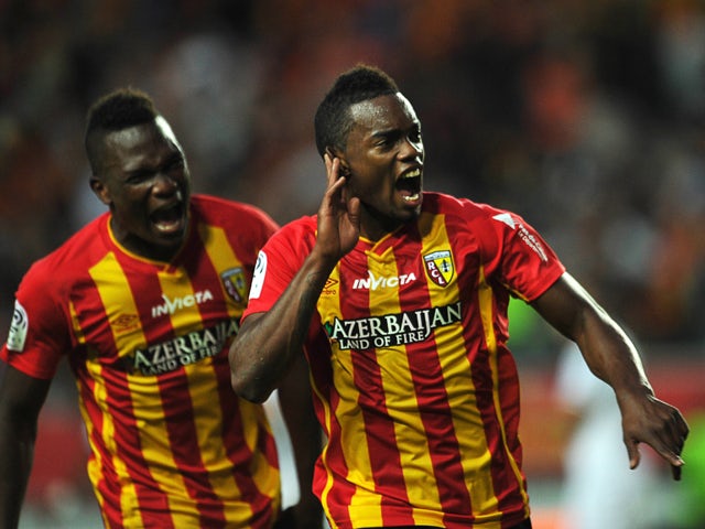 Lens French midefielder Wylan Cyprien celebrates after scoring during the French L1 football match Lens vs Reims on August 30, 2014