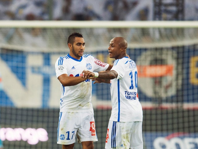 Marseille's French forward Dimitri Payet celebrates with Marseille's Ghanaian forward Andre Ayew after scoring his second goal during the French L1 football match Olympique de Marseille vs OGC Nice on August 29, 2014