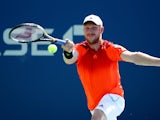 Matthias Bachinger of Germany returns a shot to Radek Stepanek of the Czech Republic during their men's singles first round match on Day One of the 2014 US Open at the USTA Billie Jean King National Tennis Center on August 25, 2014
