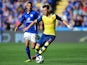 Arsenal's German midfielder Mesut Ozil (R) runs with the ball chased by Leicester City's Algerian midfielder Riyad Mahrez (L) during the English Premier League football match on August 31, 2014