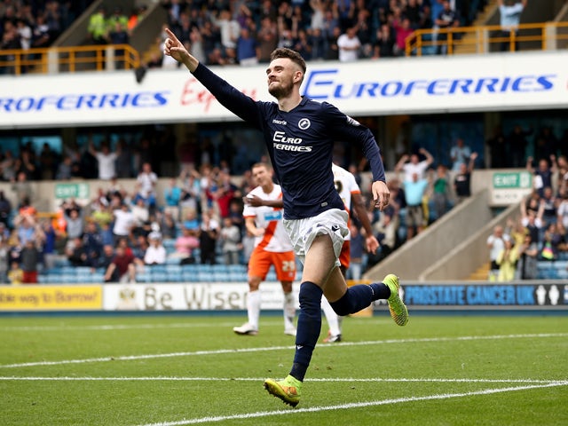 Scott Malone of Millwall celebrates after scoring to make it 2-0 during the Sky Bet Championship match between Millwall and Blackpool at The Den on August 30, 2014