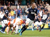 Shaun Williams of Millwall celebrates after Scott McDonald scored to make it 1-0 during the Sky Bet Championship match between Millwall and Blackpool at The Den on August 30, 2014