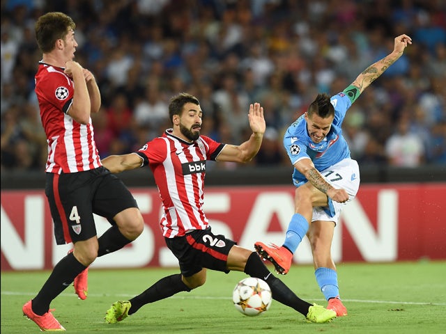 Mikel Balenziaga of Athletic Bilbao and Marek Hamsik of Napoli in action during the first leg of UEFA Champions League qualifying play-offs round match between SSC Napoli and Athletic Club on August 19, 2014