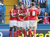 Henri Lansbury of Nottingham Forest celebrates with team mates after scoring the opening goal during the Sky Bet Championship match between Sheffield Wednesday and Nottingham Forest at Hillsborough Stadium on August 30, 2014