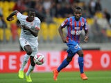 Rennes' French midfielder Abdoulaye Doucoure vies for the ball with Caen's French forward Lenny Nangis during the French L1 football match between Caen (SM Caen) and Stade Rennais (SRFC) on August 30, 2014