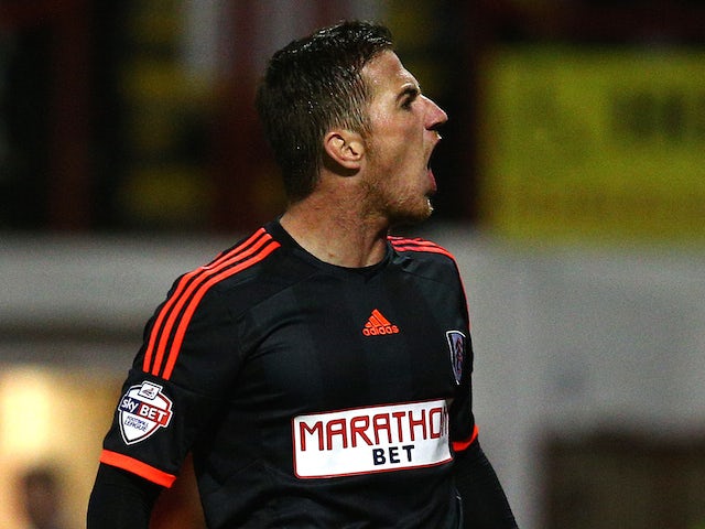 Ross McCormack of Fulham celebrates after scoring the first goal of the game during the Capital One Cup Second Round match against Brentford on August 26, 2014