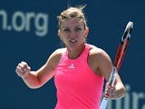 Simona Halep of Romania reacts to Danielle Rose Collins of the US during their US Open 2014 women's singles match at the USTA Billie Jean King National Center August 25, 2014