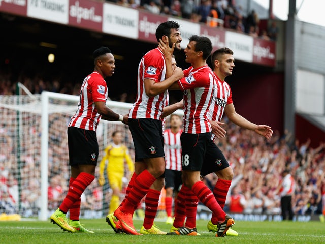 Graziano Pelle of Southampton celebrates scoring his team's third goal during the Barclays Premier League match between West Ham United and Southampton at Boleyn Ground on August 30, 2014