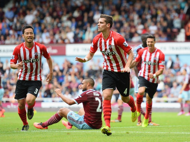 Morgan Schneiderlin of Southampton celebrates scoring the equalising goal during the Barclays Premier League match between West Ham United and Southampton at Boleyn Ground on August 30, 2014
