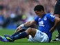 Steven Pienaar of Everton reacts to an injury during the Barclays Premier League match between Everton and Arsenal at Goodison Park on August 23, 2014
