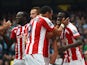 Mame Biram Diouf of Stoke City celebrates scoring the opening goal with team mates during the Barclays Premier League match between Manchester City and Stoke City at Etihad Stadium on August 30, 2014 