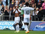 Swansea player Wayne Routledge celebrates with Wilfried Bony after scoring the second goal during the Barclays Premier League match between Swansea City and West Bromwich Albion at Liberty Stadium on August 30, 2014