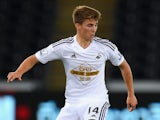 Swansea player Tom Carroll in action during the Capital One Cup Second Round match between Swansea City and Rotherham United at Liberty Stadium on August 26, 2014