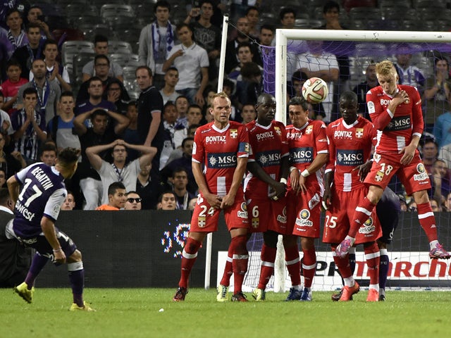 Toulouse's French Moroccan midfielder Adrien Regattin scores a goal during the French L1 football match Toulouse (TFC) against Evian Thonon Gaillard (ETGFC) on August 30, 2014