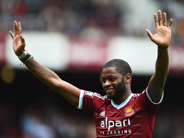 Alex Song of West Ham United acknowledges the fans as he joins the club on loan prior to the Barclays Premier League match between West Ham United and Southampton at Boleyn Ground on August 30, 2014
