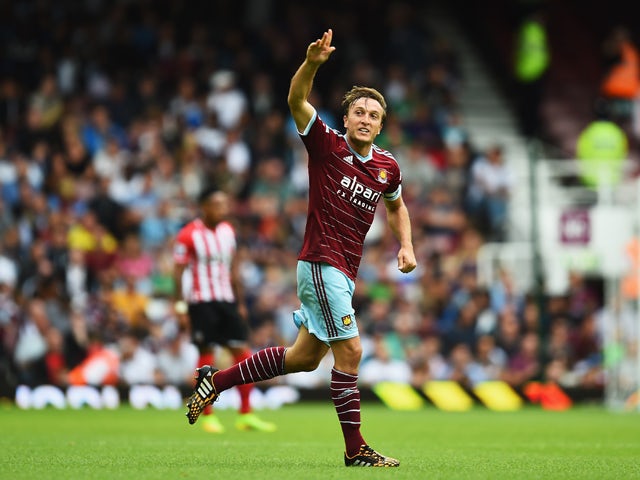 Mark Noble of West Ham United celebrates scoring his goal during the Barclays Premier League match between West Ham United and Southampton at Boleyn Ground on August 30, 2014