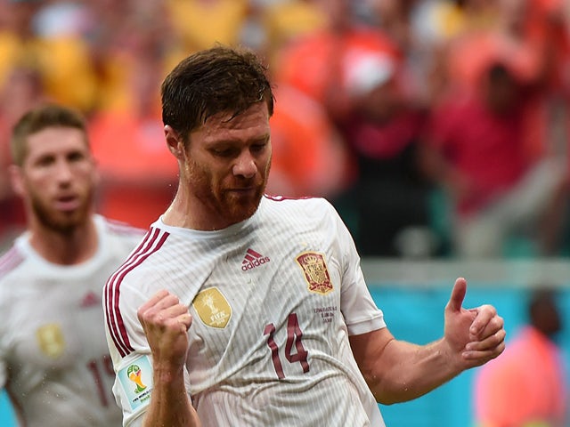 Spain's midfielder Xabi Alonso celebrates scoring a penalty during a Group B football match between Spain and the Netherlands at the Fonte Nova Arena in Salvador during the 2014 FIFA World Cup on June 13, 2014