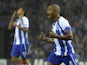 Porto's French-born Algerian midfielder Yacine Brahimi (R) celebrates after scoring a goal during the UEFA Champions League play-off game against Lille on August 26, 2014