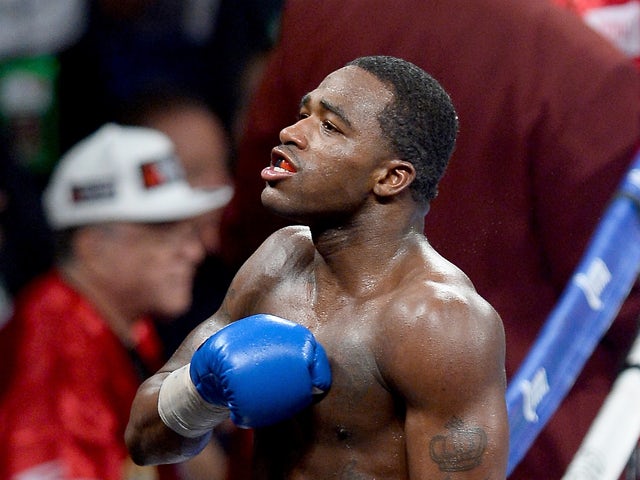 Adrien Broner celebrates his unanimous-decision victory over Carlos Molina after their super lightweight bout at the MGM Grand Garden Arena on May 3, 2014