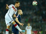 Germany's defender Benedikt Hoewedes (L) and Scotland's forward Steven Naismith vie for the ball during the UEFA Euro 2016 Group D qualifying match of Germany vs Scotland on September 7, 2014