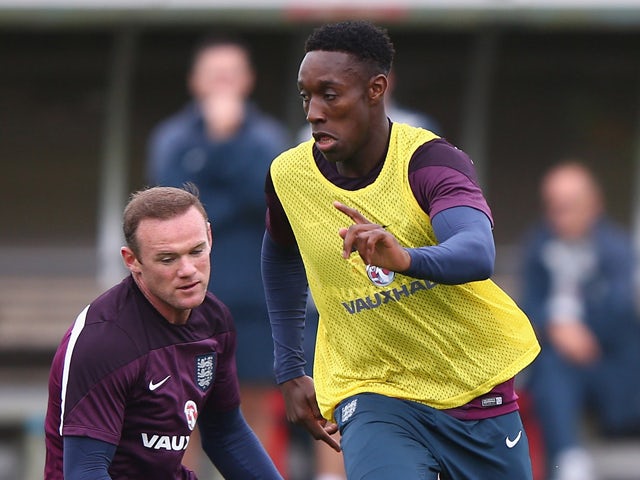  England captain Wayne Rooney tries to tackles Danny Welbeck during a England training session before the international friendly match against Norway at London Colney on September 1, 2014