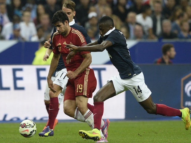 Spanish forward Diego Costa (L) vies with French midfielder Blaise Matuidi (R) during the friendly football match France vs Spain, on September 4, 2014 