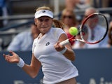 Ekaterina Makarova of Russia returns a shot to Eugenie Bouchard of Canada during their 2014 US Open women's singles match at the USTA Billie Jean King National Tennis Center September 1, 2014