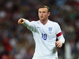 Wayne Rooney of England gestures during the International friendly match between England and Norway at Wembley Stadium on September 3, 2014