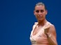 Flavia Pennetta of Italy reacts to a point against Casey Dellacqua of Australia during their women's singles fourth round match on Day Eight of the 2014 US Open at the USTA Billie Jean King National Tennis Center on September 1, 2014