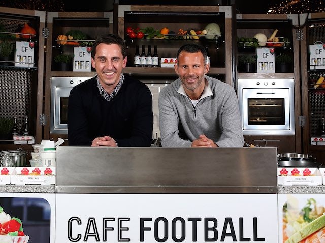Gary Neville and Ryan Giggs pose in the cafe of new venture Hotel Football